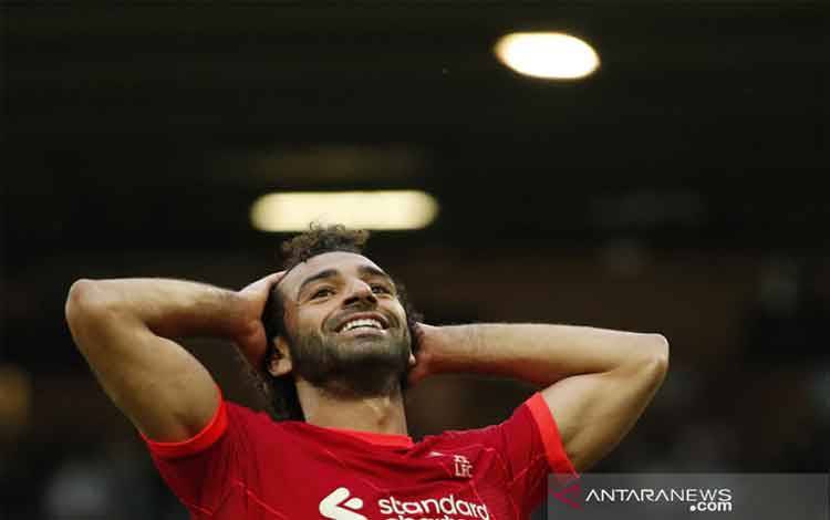 Reaksi Mohamed Salah saat memperkuat Liverpool melawan Norwich City di Cartow Road, 14 Agustus 2021. Reuters/Peter Cziborra