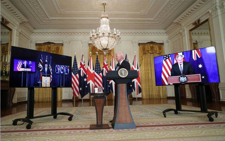 Presiden AS Joe Biden menyampaikan pidato tentang Inisiatif keamanan nasional secara virtual dengan PM Australia Scott Morrison dan PM Inggris Boris Johnson, di Gedung Putih, Washington, AS, Rabu (15/9/2021). (ANTARA/Reuters)