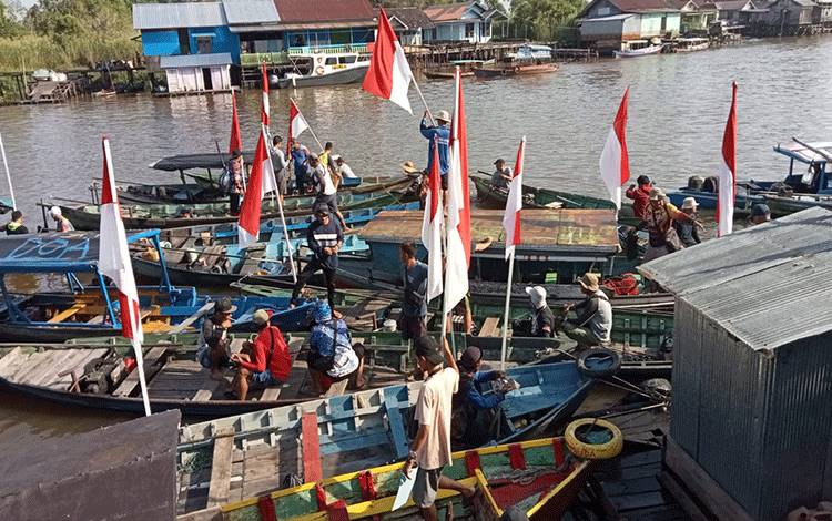 Pembukaan lomba mancing wisata di Pelabuhan Tangsi yang digelar Polres Sukamara, Minggu, 25 Juni 2023. (FOTO:NORHASANAH)