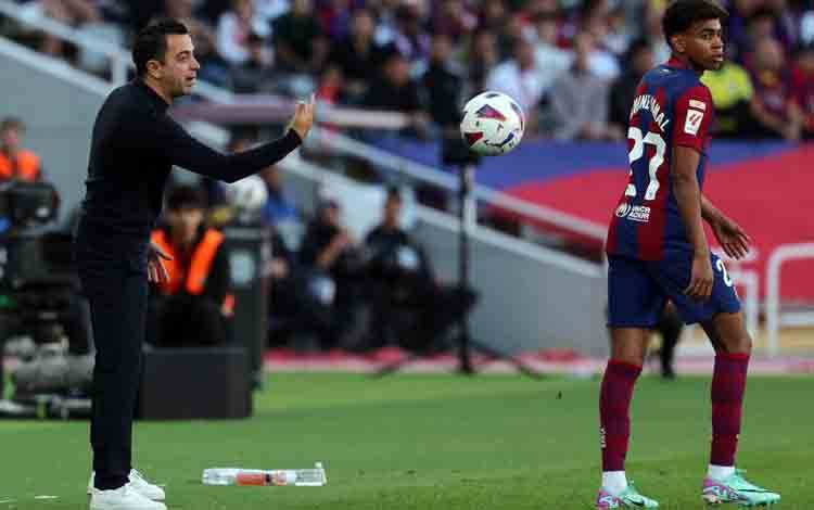 Pelatih Barcelona Xavi Hernandez (kiri). (AFP/LLUIS GENE/LLUIS GENE) (AFP/LLUIS GENE/LLUIS GENE/LLUIS GENE)